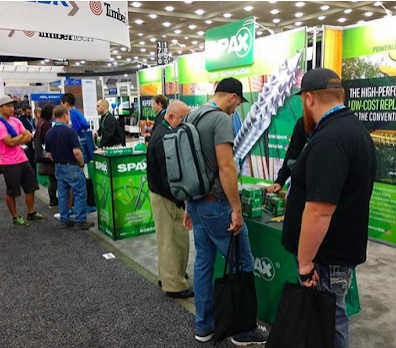 Customers checking out SPAX booth
